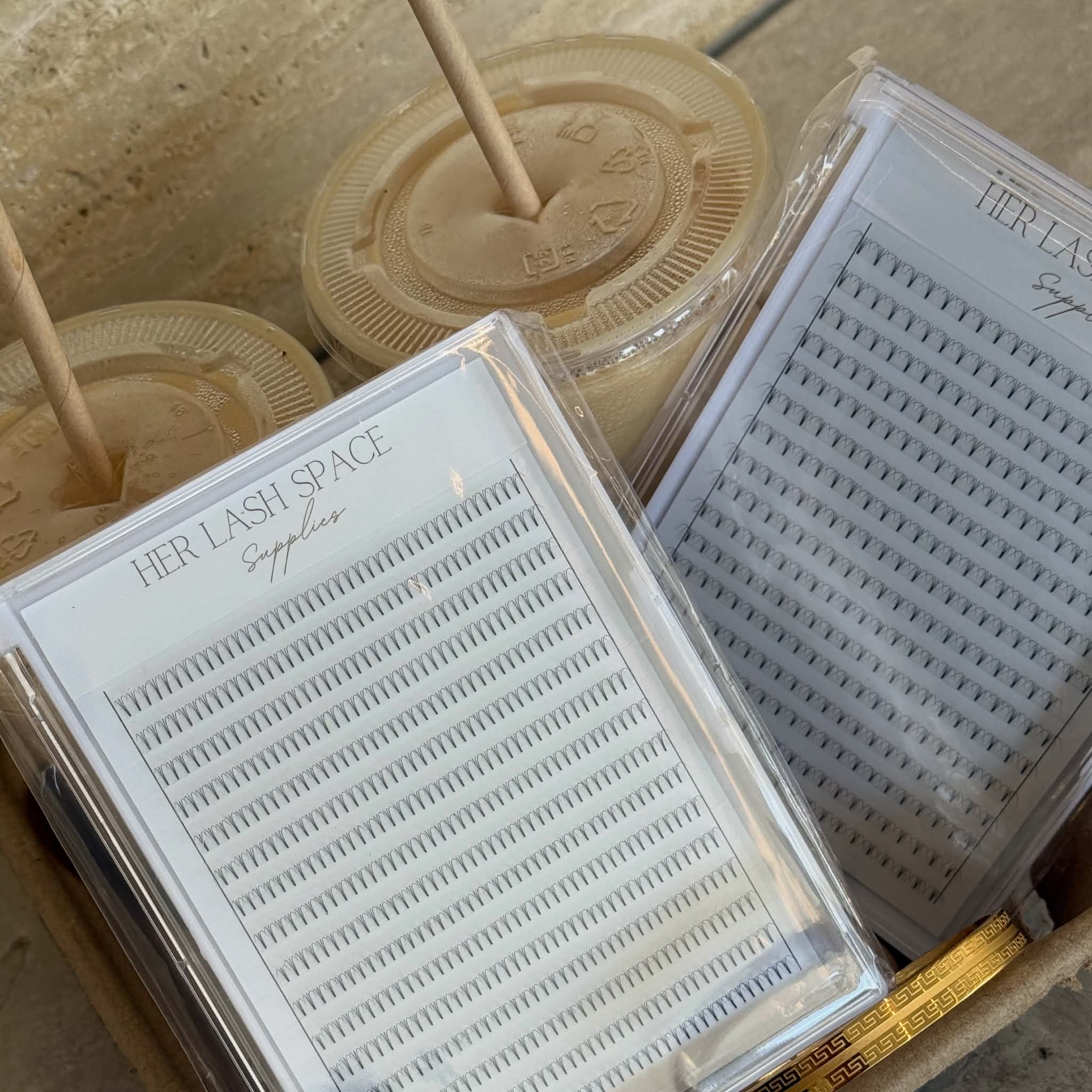 Her Lash Space Supplies lash trays ready for a volume set